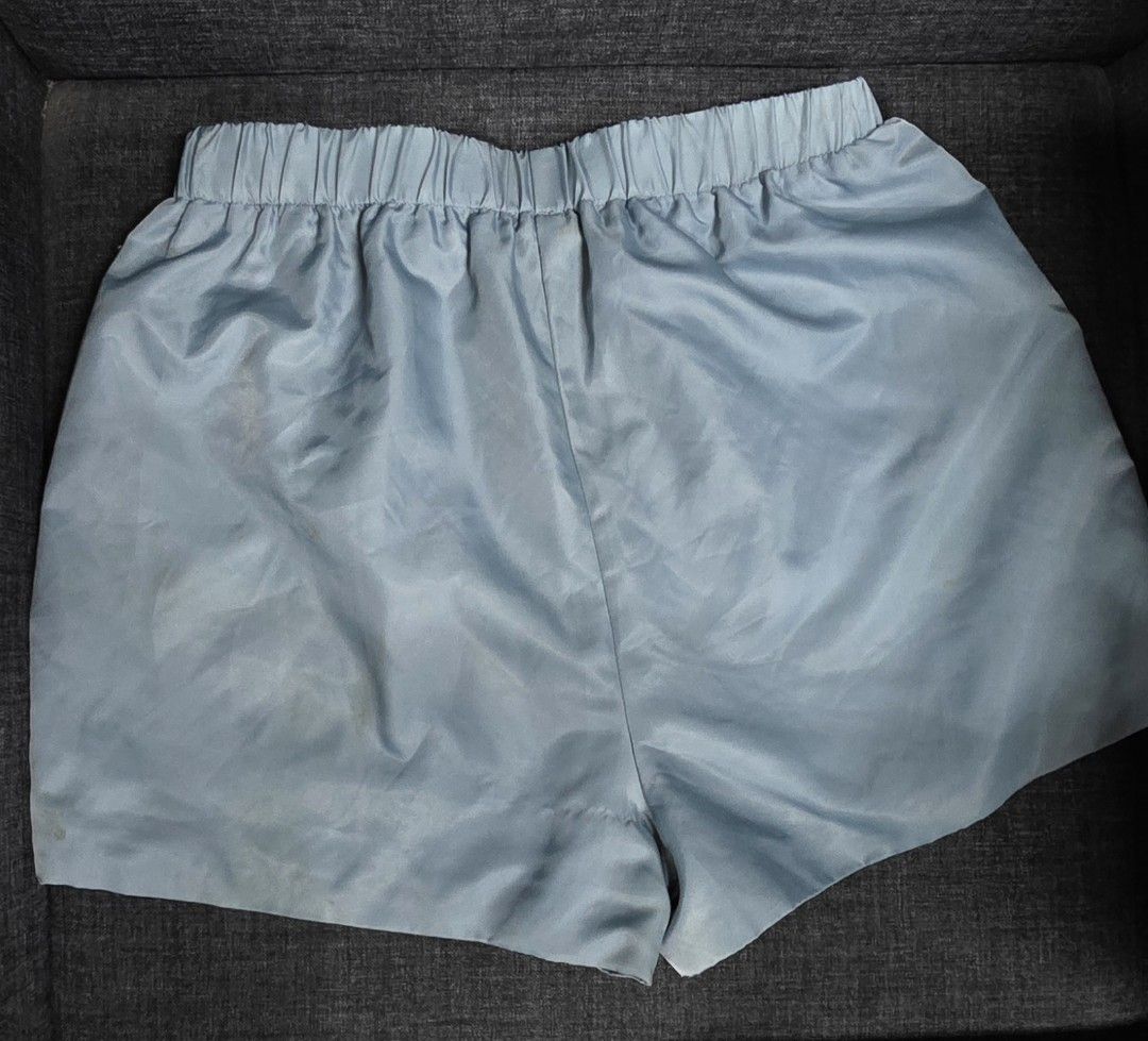 Prada Light Blue Nylon Shorts Size S (Category: Shorts) located in General Trias. Submitted by roselle2230 (Listing ID 1462822772, Image 3). Description: - Authentic Prada shorts in light blue - Made from durable nylon - Size S - Comfortable elastic waistband with drawstring - Two back pockets and one front pocket - Iconic Prada logo triangle featured on front and back.