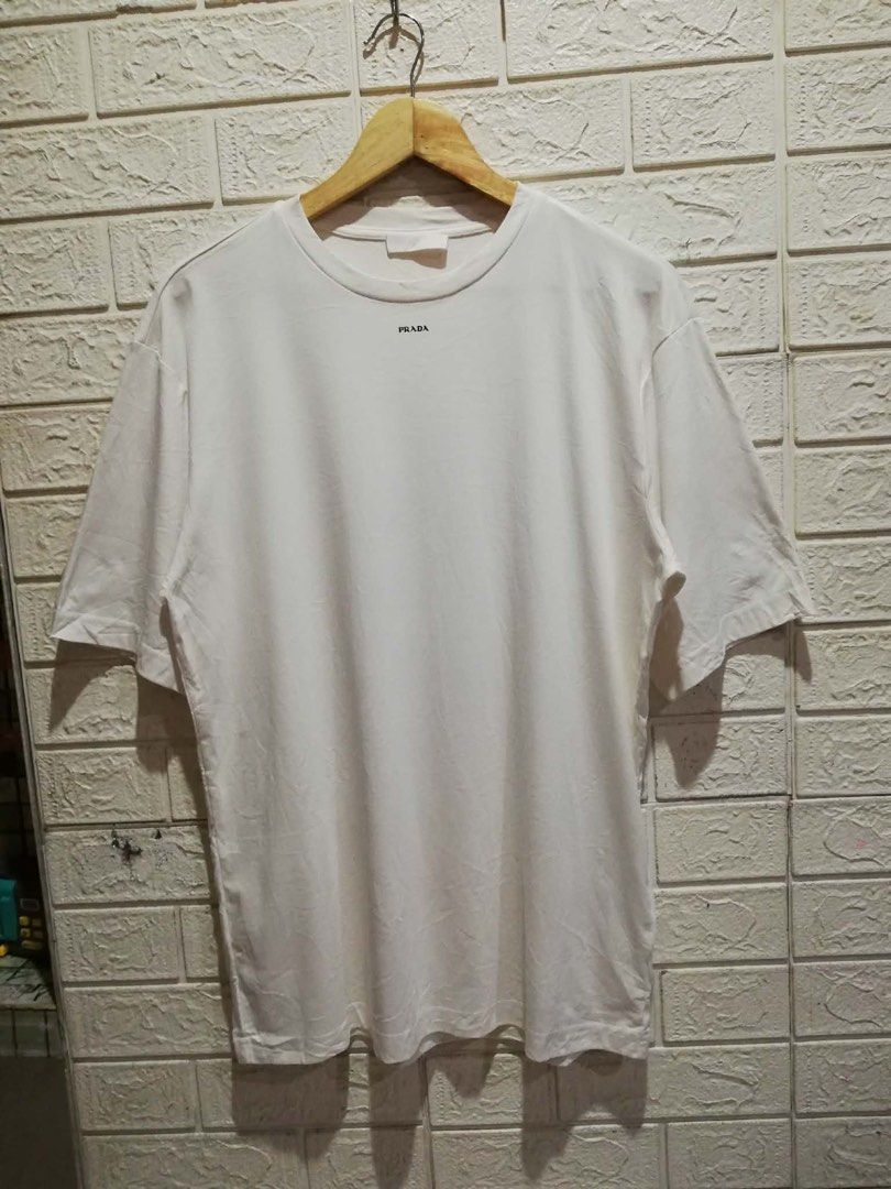 PRADA White T-Shirt (Category: Tshirts & Polo Shirts ) located in Rizal. Submitted by tiangarcia02 (Listing ID 1462830134, Image 1). Description: - Classic white Prada t-shirt - Features the iconic Prada logo on the chest - Tagged as size S - Comfortable and perfect for everyday casual wear.