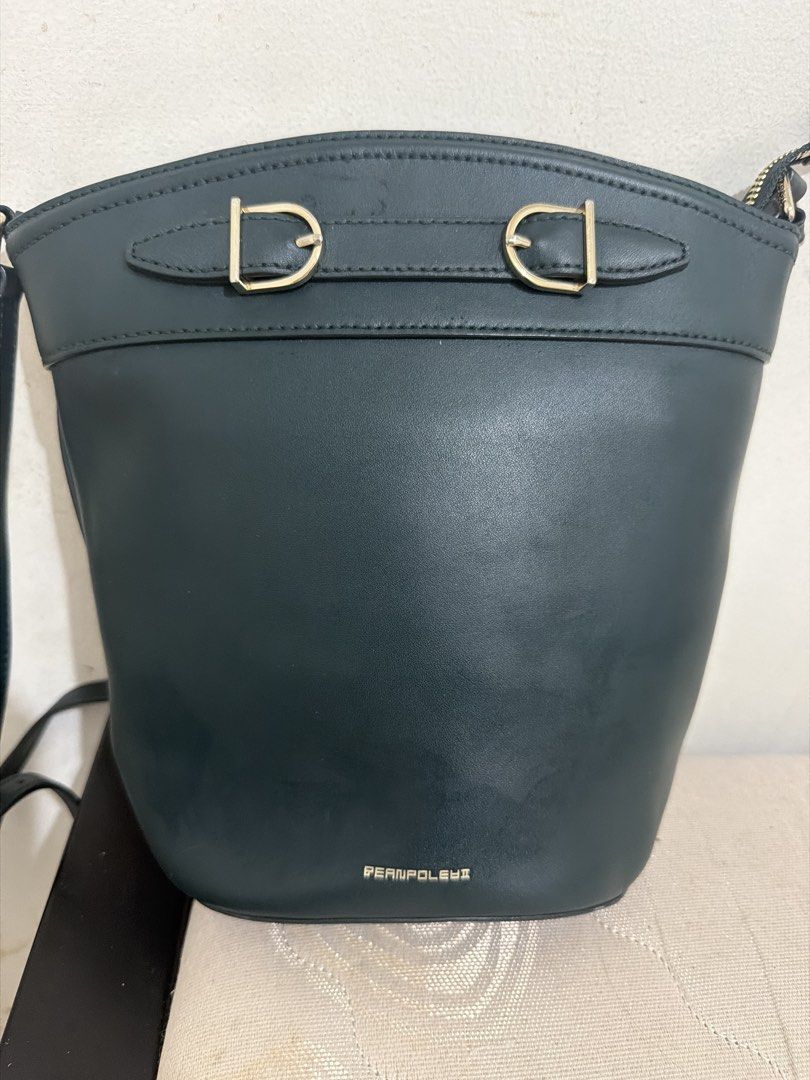 Preloved Bean Pole sling bag (Category: Cross-body Bags) located in Taytay. Submitted by welloveditems (Listing ID 1462846828, Image 1). Description: - Preloved Bean Pole sling bag - Deep green color - Stylish and versatile design - Good preloved condition.