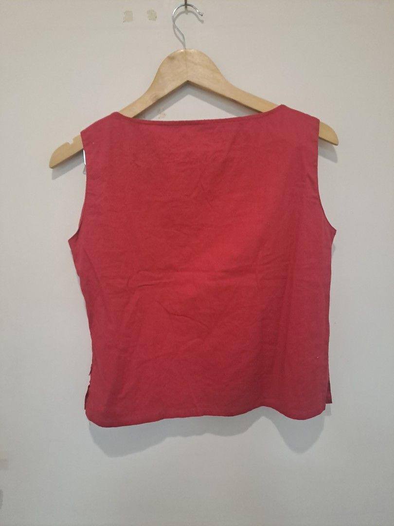 Princess and rose sleeveless linen blend (Category: Sleeveless) located in Manila. Submitted by joanbalde39643 (Listing ID 1462812136, Image 2). Description: This item is a women's square-neck sleeveless blouse, featuring thick tank straps and horizontal panel detailing across the chest. The textured, slightly wrinkled weave indicates it is made from linen or a cotton-linen blend fabric, styled in a vibrant shade of crimson red..