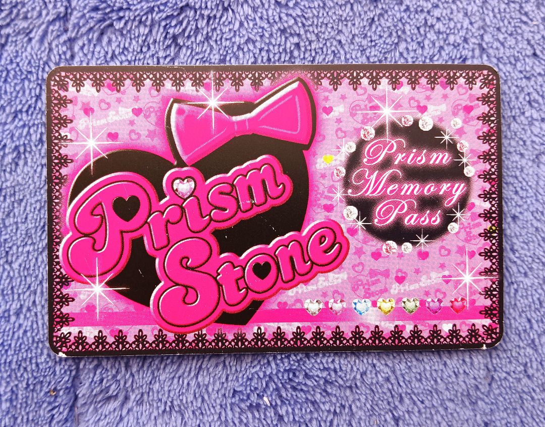 Prism Memory Pass Data Save Card Pretty Rhythm Prism Stone Anime Arcade Game (Category: Raw Singles) located in Iloilo. Submitted by jrmagallanes78 (Listing ID 1462687480, Image 1). Description: Plastic data save card Prism Memory Pass for the arcade franchise Pretty Rhythm Prism Stone anime game. Card is UNSEALED and in VERY GOOD condition with some small scuffs on the surface. Note: game is defunct and card may have expired or be non-functional