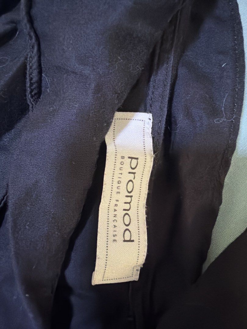 Promod Black Dress (Category: Dresses) located in Quezon City. Submitted by cynlchan (Listing ID 1462692303, Image 2). Description: - Brand: Promod - Color: Black - Neckline: V-neck with ruffled detail - Skirt: Flared with pleats - Sleeves: Sleeveless - Versatile: Great for casual or dressed-up looks - Easy to wear and style.
