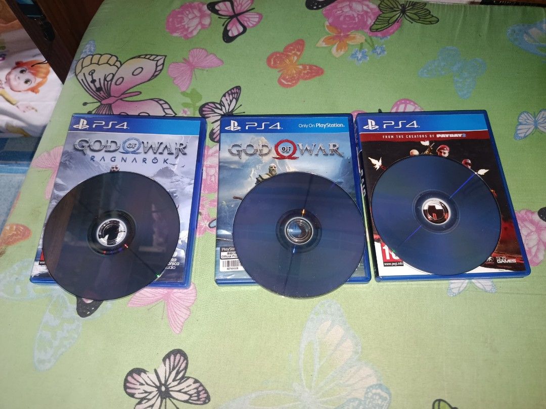 PS4 GAMES BUNDLE (TAKE ALL ₱1,700 ONLY) (Category: PlayStation) located in Manila. Submitted by faststone.7b3304 (Listing ID 1462722134, Image 1). Description: Selling 3 physical PS4 game discs as a bundle. Strictly PASS SA SWAP, cash only dahil kailangan ng funds for emergency purposes. Inclusions & Condition: God of War Ragnarök – Halos 1 month pa lang nabili! Super fresh, very smooth disc God of War (2018) – Minimal light scratches, 100% worki