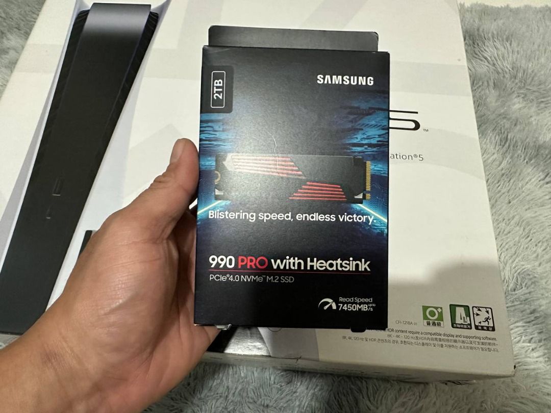 Ps5 disc edition with 2TB Samsung 990 PRO (Category: PlayStation) located in Manila. Submitted by gadjetseller122889 (Listing ID 1462718525, Image 2). Description: Ps5 disc edition with 2TB Samsung 990 PRO with heatsink Ps5 Original controller Ps5 Stand HDMI Power Cord Games: It takes two.
