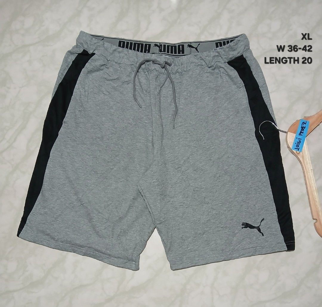 Puma Men's Grey Athletic Shorts XL (Category: Shorts) located in Plaridel. Submitted by igieperez147282 (Listing ID 1462843795, Image 1). Description: - Grey Puma shorts - Black side stripes - Elastic waistband with drawstring - Size XL (fits waist 36-42 inches) - Length: 20 inches - Made in Cambodia - Ideal for casual wear or sports.