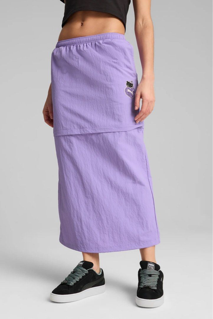 Puma x Hello Kitty Purple Skirt (Category: Skirts) located in Muntinlupa City. Submitted by pearlsarchives (Listing ID 1462837072, Image 1). Description: - Collaboration: Puma x Kitty - Color: Purple - Style: Midi skirt - Features: Elastic waistband with drawstring, back slit - Versatile: Great for casual or sporty looks - Design: Super cute!.