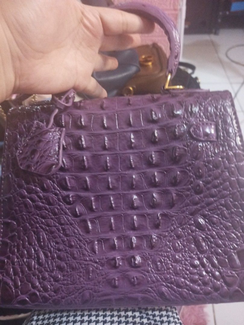 Purple Crocodile Embossed Top Handle Bag (Category: Luxury Bags & Wallets) located in Manila. Submitted by maritanaai22557 (Listing ID 1462769072, Image 2). Description: - Stylish purple handbag - Crocodile embossed texture - Elegant gold hardware closure - Convenient top handle - Structured design - Includes a small hanging tag.
