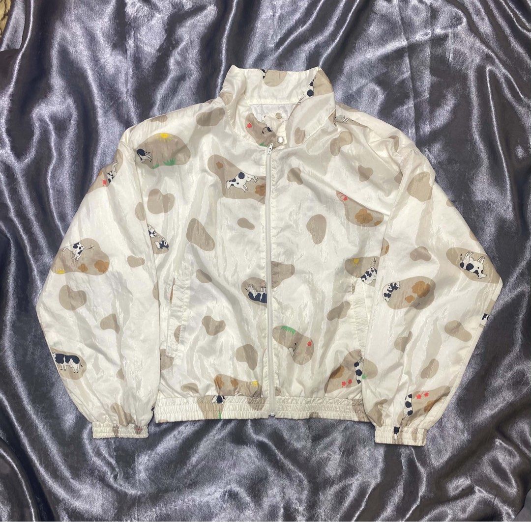 QUANTUM USA Windbreaker Jacket Cow Print (Category: Coats, Jackets and Outerwear) located in Cavite. Submitted by bellewii (Listing ID 1462843621, Image 1). Description: - QUANTUM USA cow print windbreaker jacket - White base with brown & black cow graphics - Zip-up front with snap button collar closure - Elasticated cuffs and hem - Made of 100% Nylon - Ideal for casual wear.