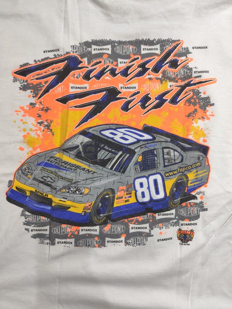 Racing tee, Car tee, Nascar (Category: Tshirts & Polo Shirts ) located in Cebu City. Submitted by icoolectnsellect (Listing ID 1462737930, Image 2). Description: - White Gildan Ultra Cotton T-shirt - Size: 23x30 inches - Back Graphic: "Finish First" with race car and sponsor logos - Front Logo: Small "Florissant Auto Wash" on left chest - Ideal for racing enthusiasts.