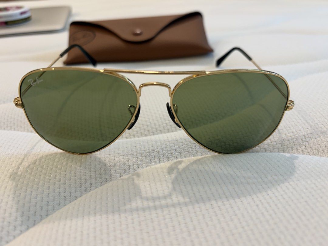 Ray-Ban Aviator (Category: Sunglasses & Eyewear) located in Makati City. Submitted by chumamba (Listing ID 1462711651, Image 3). Description: Authentic rayban Barely used Comes with Eyewear, fabric and case only Replaced nose pads due to losing 1 side Meet up in glorietta Grab or lala move at buyers expense - Classic Ray-Ban Aviator sunglasses - Gold metal frame - Green lenses - Comes with original Ray-Ban case - Timeless style, perfect for every
