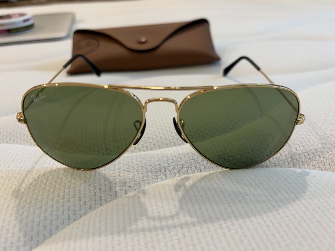 Ray-Ban Aviator (Category: Sunglasses & Eyewear) located in Makati City. Submitted by chumamba (Listing ID 1462711651, Image 2). Description: Authentic rayban Barely used Comes with Eyewear, fabric and case only Replaced nose pads due to losing 1 side Meet up in glorietta Grab or lala move at buyers expense - Classic Ray-Ban Aviator sunglasses - Gold metal frame - Green lenses - Comes with original Ray-Ban case - Timeless style, perfect for every