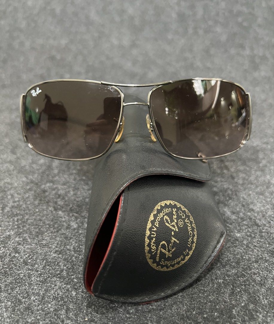 Ray-Ban Sunglasses with Case (Category: Sunglasses & Eyewear) located in Mandaluyong City. Submitted by maropa (Listing ID 1462779988, Image 2). Description: - Authentic Ray-Ban sunglasses - Silver frame - Brown gradient lenses - Comes with original Ray-Ban case - Ideal for sunny weather - Feel free to ask questions!.