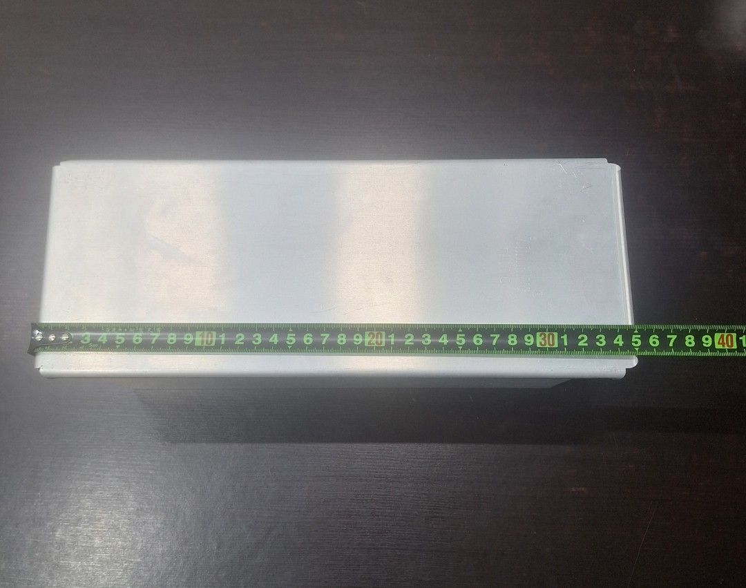 Rectangular Loaf Pan for Baking Bread (Category: Bakeware) located in Singapore. Submitted by florinsthon (Listing ID 1462861548, Image 2). Description: - Rectangular loaf pan with cover - Non-stick coating for easy release - Perforated bottom for even heat distribution - Ideal for baking bread, cakes, and more - Approximate dimensions: 35cm (L) x 13cm (W) Large size.