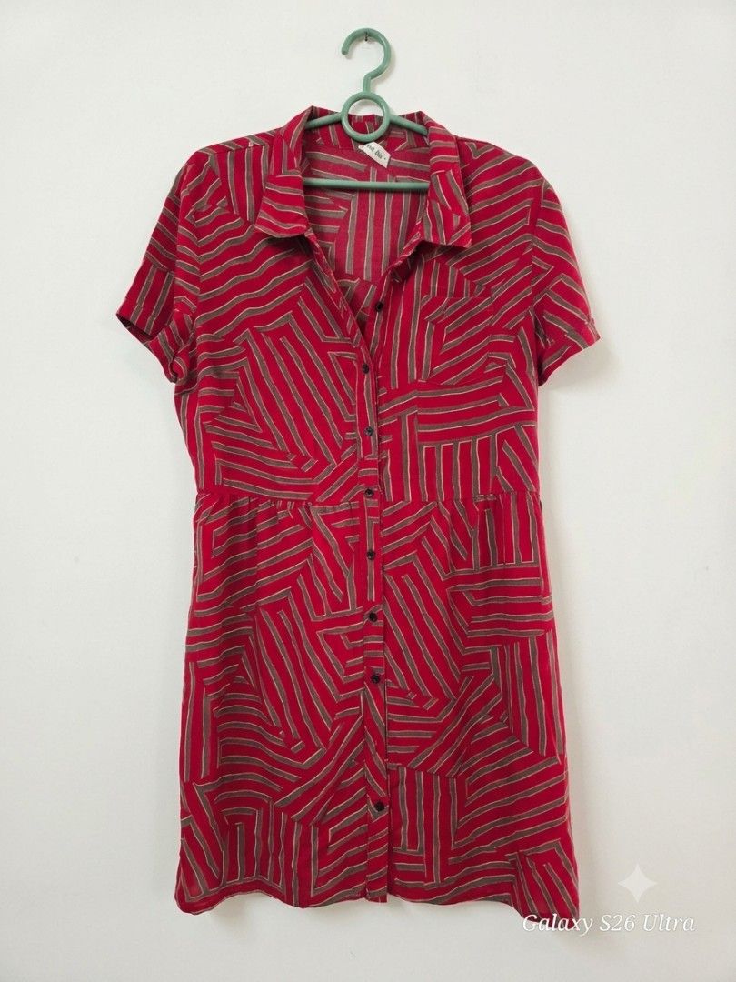 Red Geometric Print Button-Up Shirt Dress (Category: Dresses) located in Manila. Submitted by annamolly1986 (Listing ID 1462703621, Image 1). Description: - Eye-catching red dress with a unique geometric stripe pattern. - Features short sleeves and a convenient button-up front. - Comfortable elasticated waist for a flattering fit. - Versatile for casual outings or office wear. - Easily pairs with sneakers or sandals for different looks..