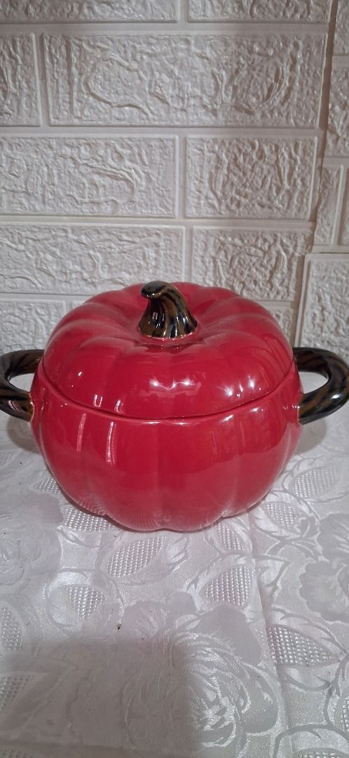 Red Pumpkin Ceramic Pot with Lid (Category: Cookware & Accessories) located in Manila. Submitted by katkween23 (Listing ID 1462733822, Image 3). Description: - Adorable red pumpkin-shaped pot with a lid. - Features convenient side handles. - Ideal for serving dishes or as a charming decorative piece. - Adds a festive touch to fall or Halloween themes. - Approximate size: [hand size for scale]..