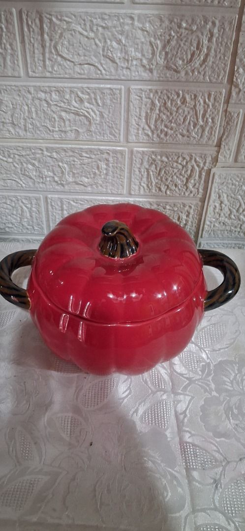 Red Pumpkin Ceramic Pot with Lid (Category: Cookware & Accessories) located in Manila. Submitted by katkween23 (Listing ID 1462733822, Image 2). Description: - Adorable red pumpkin-shaped pot with a lid. - Features convenient side handles. - Ideal for serving dishes or as a charming decorative piece. - Adds a festive touch to fall or Halloween themes. - Approximate size: [hand size for scale]..
