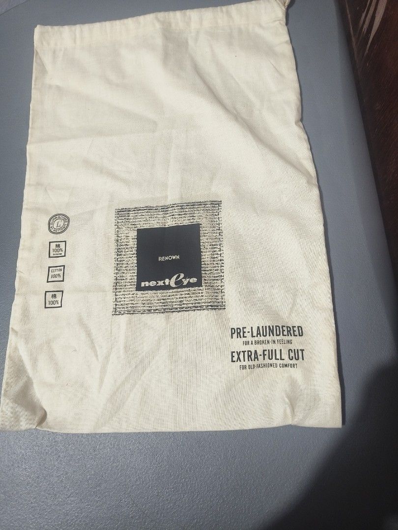 Renown Next Eye Cotton Drawstring Dust Bag (Category: Luxury Bags & Wallets) located in San Jose del Monte. Submitted by m_nshop (Listing ID 1462814043, Image 1). Description: - Cream colored drawstring dust bag - Made of 100% cotton - Pre-laundered for extra comfort - Generous size: Approx. 18" wide x 16" tall - Features a small logo print - Ideal for storing shoes, gym gear, or other small essentials payment first jnt or lalamove courier.