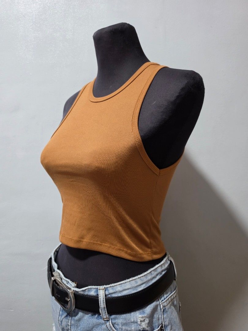 Ribbed Tank Top - Brown small (Category: Sleeveless) located in Paranaque City. Submitted by franinnashop (Listing ID 1462692786, Image 2). Description: - Brown ribbed tank top - Sleeveless design - Stretchy material for a comfortable fit - Versatile for casual wear - Easy to style with jeans, a belt, and other outfits decluttet small paranaque city.