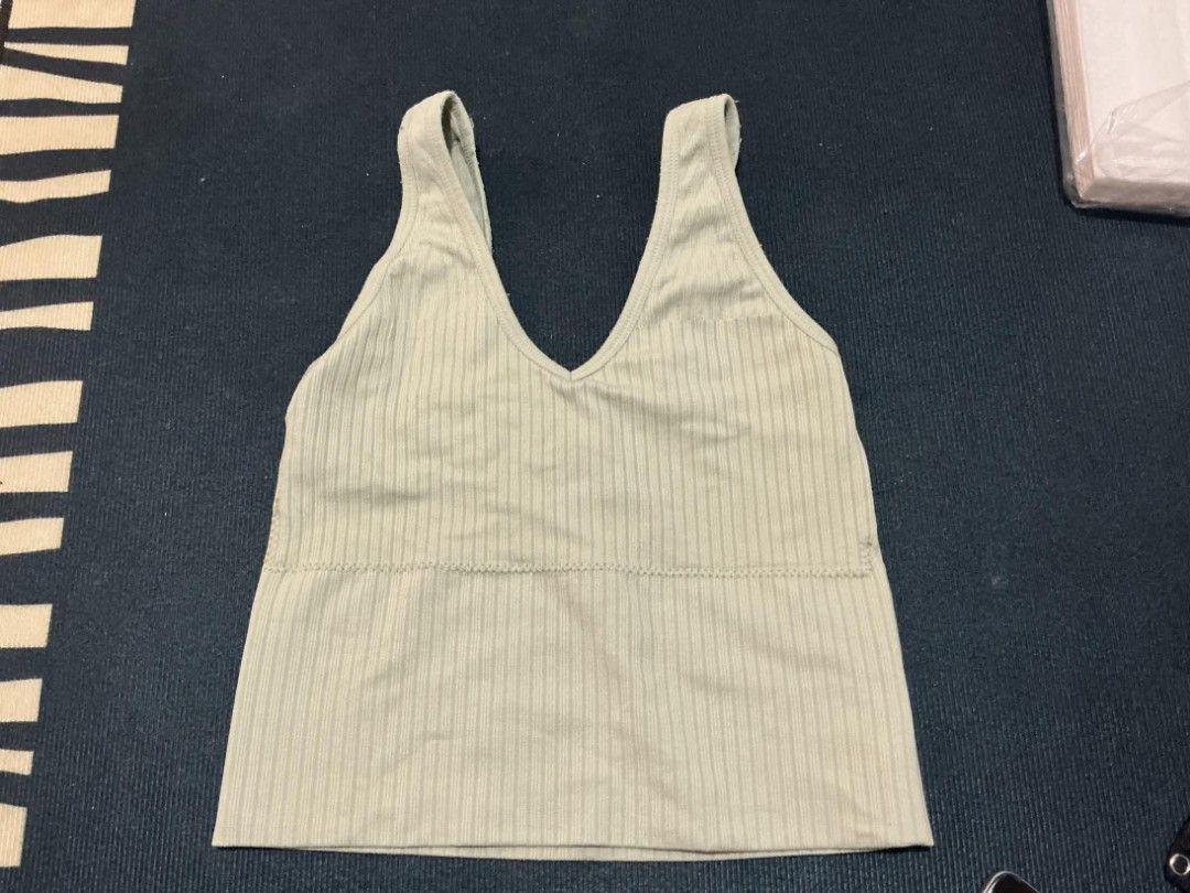 Ribbed V-neck Tank Top (Category: Sleeveless) located in Quezon City. Submitted by nicskulasa (Listing ID 1462811369, Image 1). Description: - Light green ribbed tank top - Flattering V-neck design - Comfortable thick straps - Stretchy material for a great fit - Waist-length cut - Versatile: wear alone or layer.