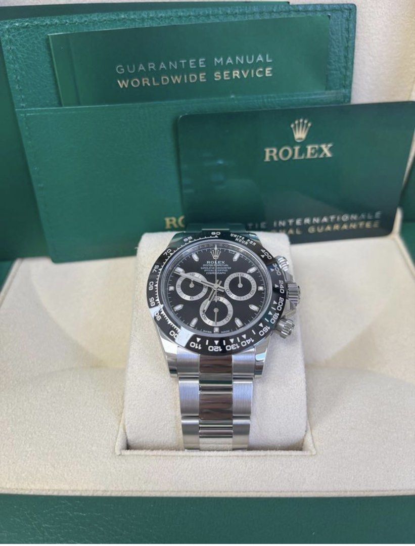 Rolex Daytona Black Dial Stainless Steel Watch (Category: Watches) located in Singapore. Submitted by jochew37 (Listing ID 1462769545, Image 2). Description: - Rolex Daytona - Black dial - Stainless steel bracelet - Chronograph function - Original box and papers included - Ideal for collectors - Serious buyers only Year 2024 Unworn Rolex Cosmograph Daytona 116500LN featuring the classic black dial and iconic black Cerachrom bezel. The 40mm Oyster