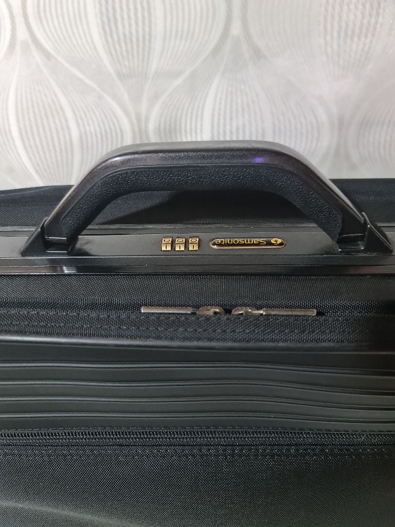Samsonite Black Briefcase with Combination Lock (Category: Briefcases) located in Tarlac. Submitted by jeremiah.curator.2026 (Listing ID 1462713491, Image 2). Description: - Stylish black briefcase - Front zipper pocket for quick access - Integrated combination lock for enhanced security - Ample interior space for documents and laptop - Durable and comfortable sturdy handle - Smooth-gliding zippers - Ideal for both professional use and travel.