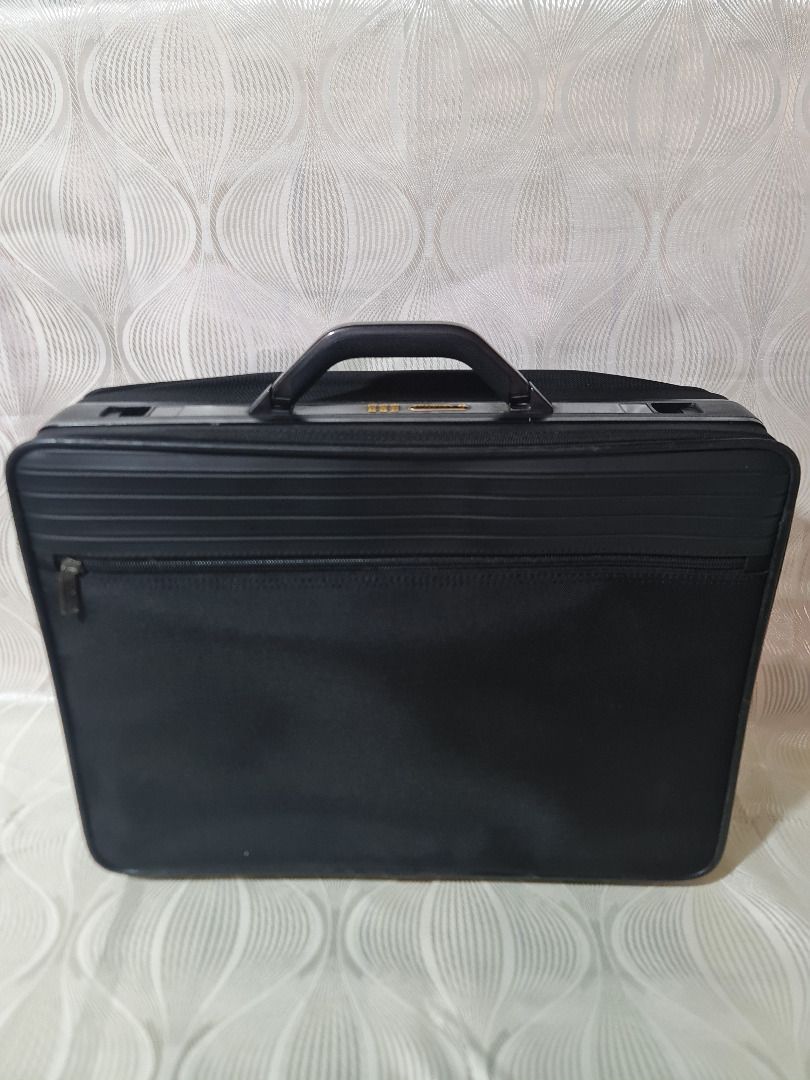 Samsonite Black Briefcase with Combination Lock (Category: Briefcases) located in Tarlac. Submitted by jeremiah.curator.2026 (Listing ID 1462713491, Image 3). Description: - Stylish black briefcase - Front zipper pocket for quick access - Integrated combination lock for enhanced security - Ample interior space for documents and laptop - Durable and comfortable sturdy handle - Smooth-gliding zippers - Ideal for both professional use and travel.