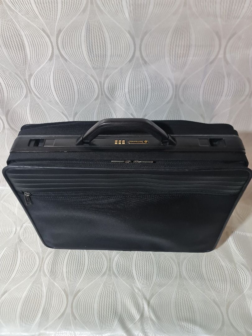 Samsonite Black Briefcase with Combination Lock (Category: Briefcases) located in Tarlac. Submitted by jeremiah.curator.2026 (Listing ID 1462713491, Image 1). Description: - Stylish black briefcase - Front zipper pocket for quick access - Integrated combination lock for enhanced security - Ample interior space for documents and laptop - Durable and comfortable sturdy handle - Smooth-gliding zippers - Ideal for both professional use and travel.