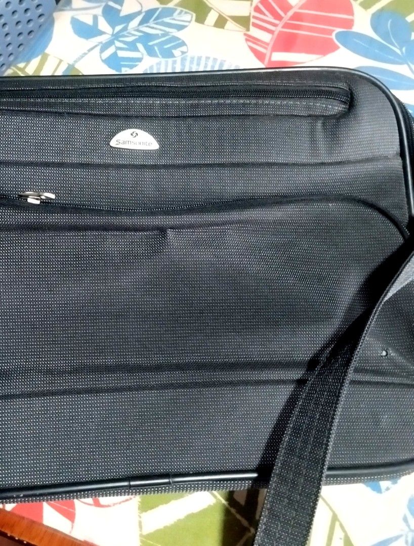 Samsonite Black Laptop Bag with Shoulder Strap (Category: Laptop Bags & Sleeves) located in Manila. Submitted by lene48 (Listing ID 1462761872, Image 1). Description: - Samsonite laptop bag in classic black. - Main compartment for your laptop and essentials. - Front zippered pocket for quick access to accessories. - Detachable and adjustable shoulder strap for comfortable carrying. - Made with durable material for long-lasting use. - Ideal for bo