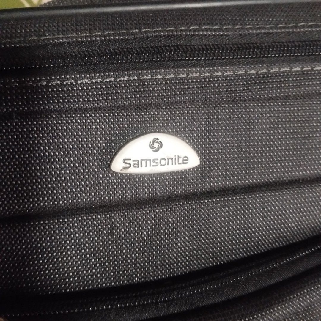 Samsonite Black Laptop Bag with Shoulder Strap (Category: Laptop Bags & Sleeves) located in Manila. Submitted by lene48 (Listing ID 1462761872, Image 2). Description: - Samsonite laptop bag in classic black. - Main compartment for your laptop and essentials. - Front zippered pocket for quick access to accessories. - Detachable and adjustable shoulder strap for comfortable carrying. - Made with durable material for long-lasting use. - Ideal for bo