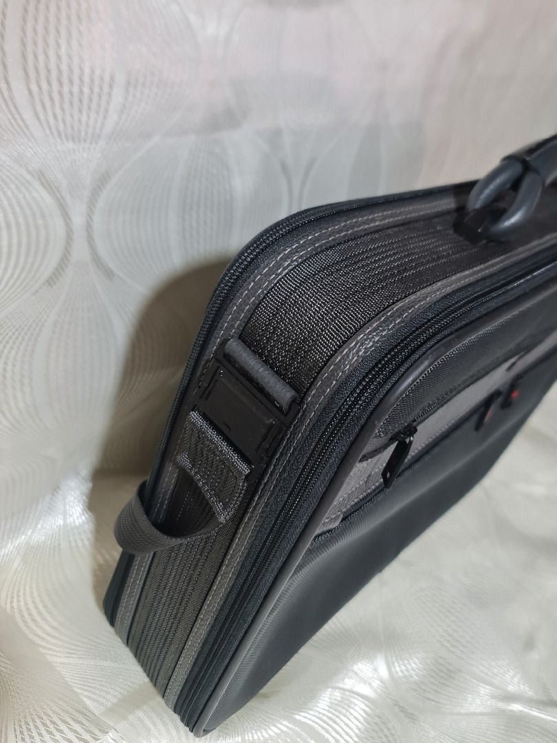 Samsonite Laptop Bag Briefcase (Category: Briefcases) located in Tarlac. Submitted by jeremiah.curator.2026 (Listing ID 1462711249, Image 3). Description: - Brand: Samsonite - Color: Black with grey accents - Features: Padded handle, detachable shoulder strap - Organization: Multiple zippered compartments - Ideal for: Work or travel - Condition: Durable material, ready for its next owner.