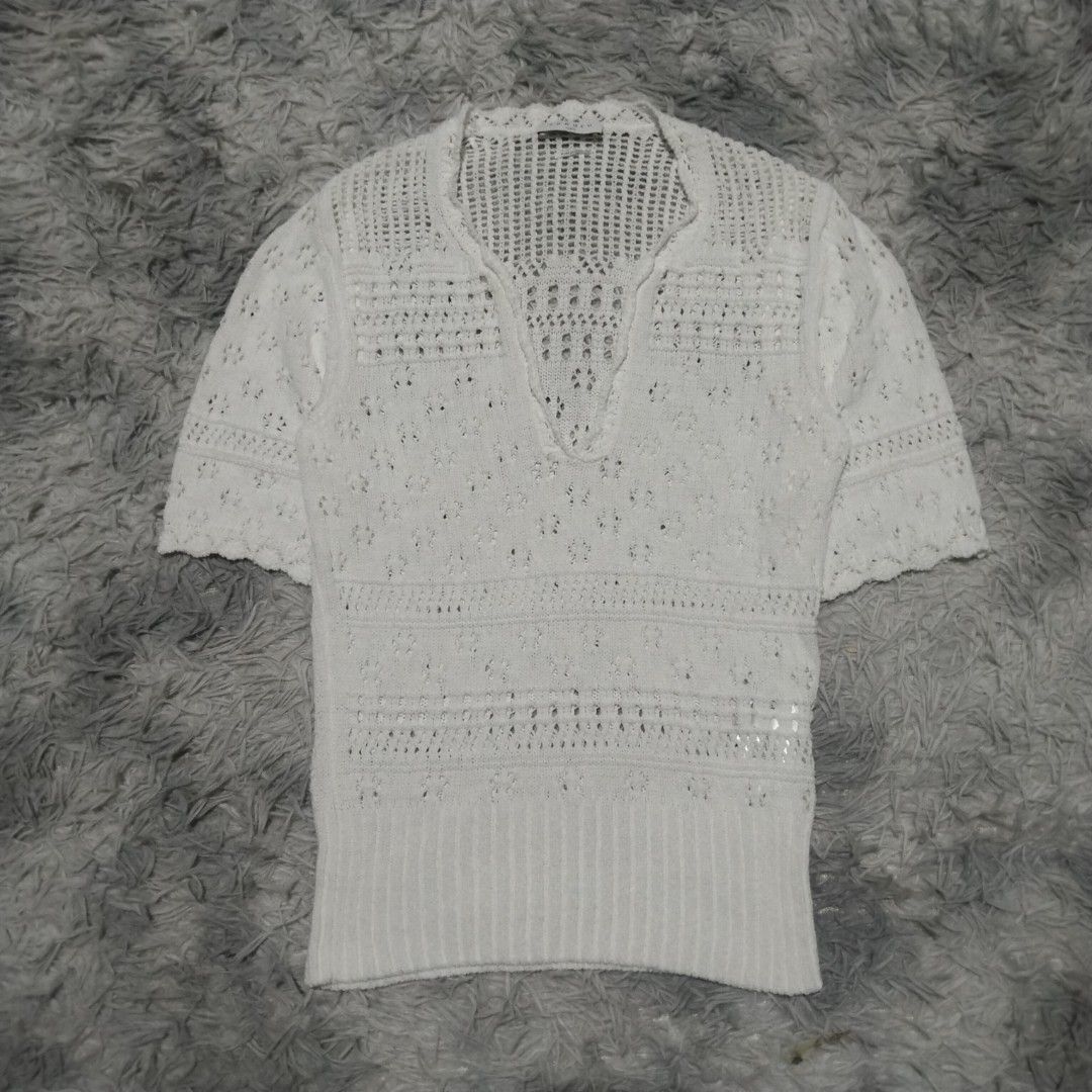 SANDRO PARIS KNITTED (Category: Blouses) located in Dasmarinas. Submitted by oneofakind_98 (Listing ID 1462865302, Image 3). Description: SANDRO PARIS This is a white short-sleeved pointelle-knit sweater by Sandro featuring an open-knit floral pattern and a scalloped V-neckline. - Strechy Measurement when Iaid flat Size 1 on tag 17 inches armpit to armpit 24 inches length 15.5 inches shoulder to shoulder 15.5 inches chest 12 inches short sleeve 1