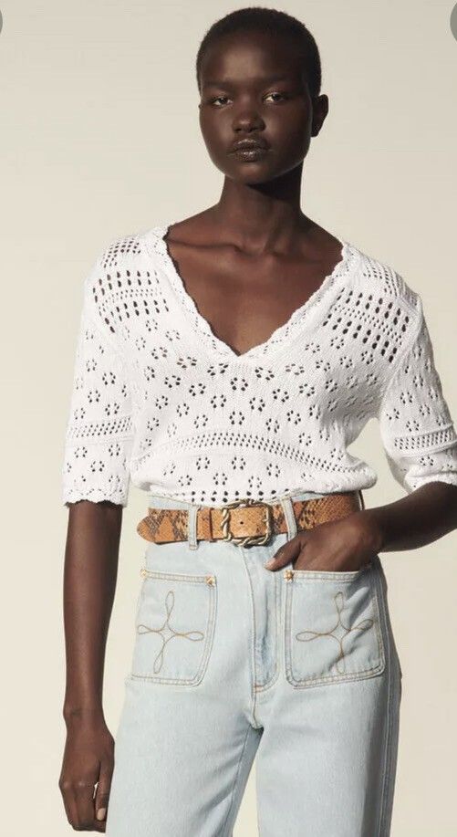 SANDRO PARIS KNITTED (Category: Blouses) located in Dasmarinas. Submitted by oneofakind_98 (Listing ID 1462865302, Image 1). Description: SANDRO PARIS This is a white short-sleeved pointelle-knit sweater by Sandro featuring an open-knit floral pattern and a scalloped V-neckline. - Strechy Measurement when Iaid flat Size 1 on tag 17 inches armpit to armpit 24 inches length 15.5 inches shoulder to shoulder 15.5 inches chest 12 inches short sleeve 1