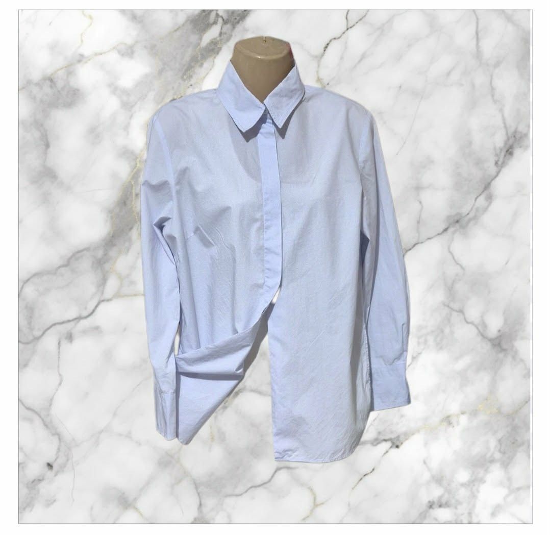 Sandro Paris Poplin shirt (Category: Longsleeves) located in Paranaque City. Submitted by calm_youngstore7 (Listing ID 1462806852, Image 3). Description: Sandro Adama poplin shirt Light blue Sandro Paris cotton button-down shirt featuring a minimalist design with a clean, concealed button placket. Sandro Paris is a French premium fashion house recognized for its sleek tailoring and contemporary wardrobe staples. This particular piece showcases a 