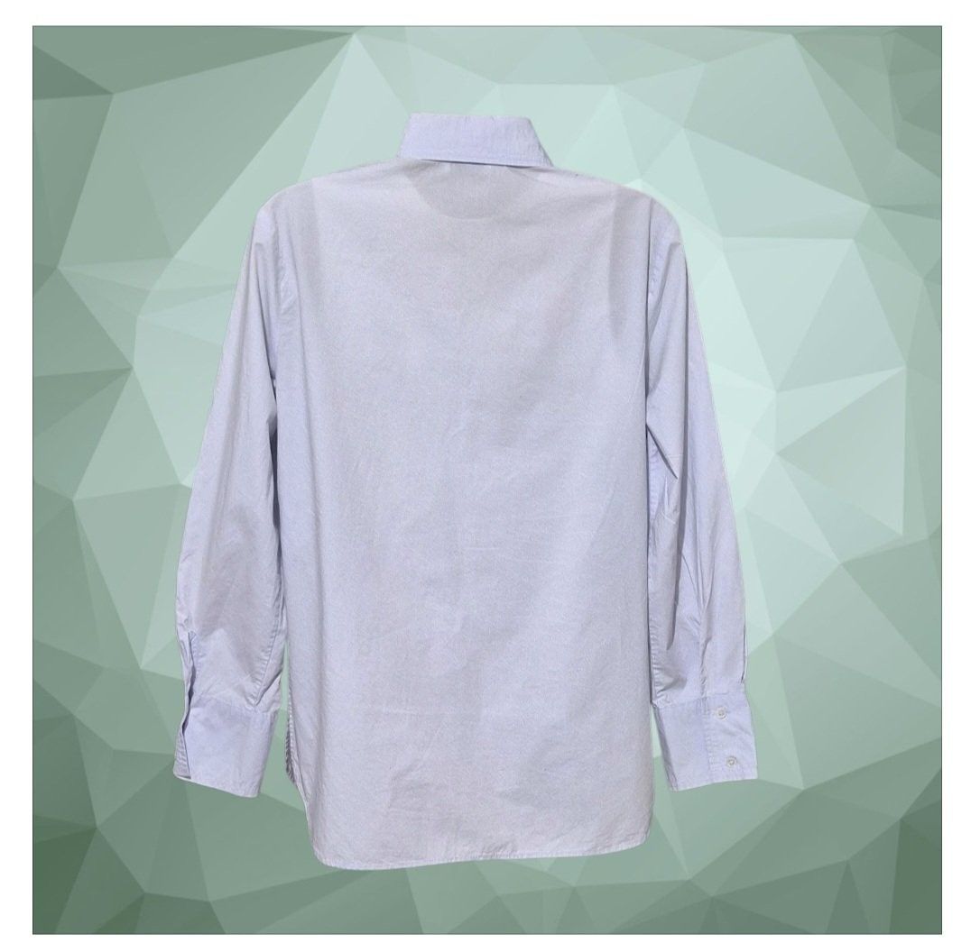 Sandro Paris Poplin shirt (Category: Longsleeves) located in Paranaque City. Submitted by calm_youngstore7 (Listing ID 1462806852, Image 2). Description: Sandro Adama poplin shirt Light blue Sandro Paris cotton button-down shirt featuring a minimalist design with a clean, concealed button placket. Sandro Paris is a French premium fashion house recognized for its sleek tailoring and contemporary wardrobe staples. This particular piece showcases a 