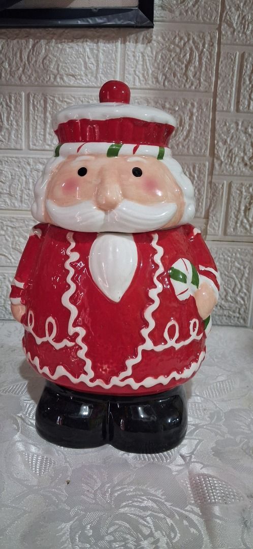 Santa Claus Ceramic Cookie Jar with Lid (Category: Other Home Decor) located in Manila. Submitted by katkween23 (Listing ID 1462734013, Image 2). Description: - Adorable Santa Claus ceramic cookie jar - Ideal for storing cookies and holiday treats - Snug-fitting lid to keep contents fresh - Charming Christmas decor piece - Features hand-painted details - Measures approximately [insert height here] inches tall - A delightful addition to your kitch