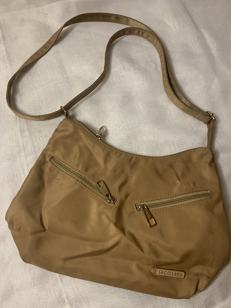 Secosana Tan Nylon Shoulder Bag (Category: Shoulder Bags) located in Manila. Submitted by chic_closet73 (Listing ID 1462844903, Image 1). Description: - Brand: Secosana - Color: Tan - Material: Nylon - Pockets: Multiple zippered pockets on front and back - Strap: Adjustable - Hardware: Gold-tone - Ideal for: Everyday use.