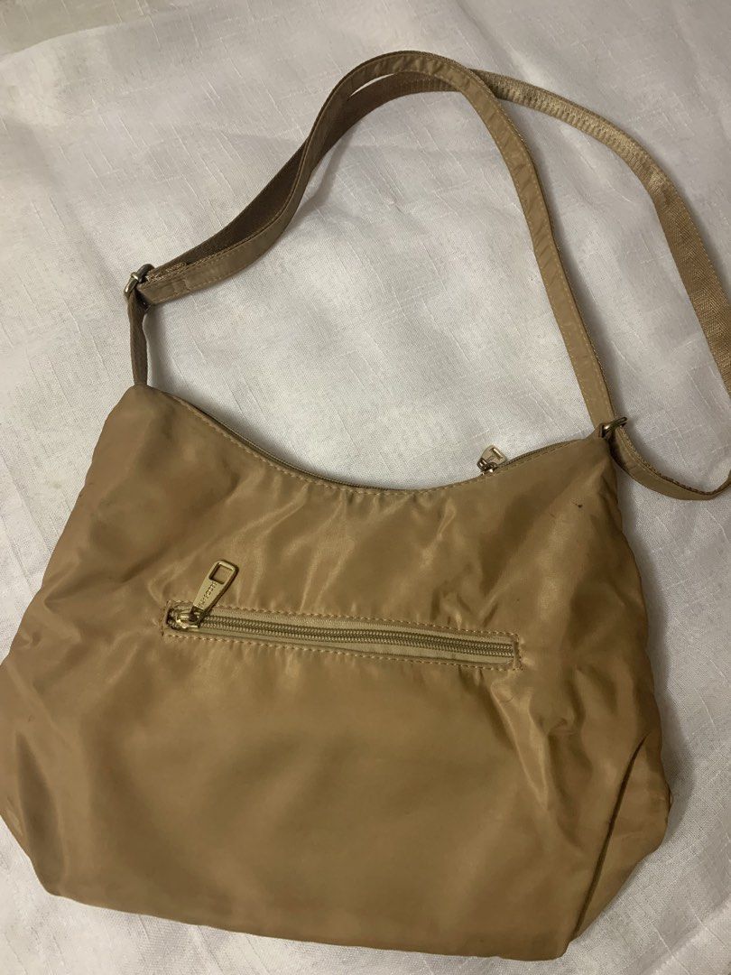 Secosana Tan Nylon Shoulder Bag (Category: Shoulder Bags) located in Manila. Submitted by chic_closet73 (Listing ID 1462844903, Image 2). Description: - Brand: Secosana - Color: Tan - Material: Nylon - Pockets: Multiple zippered pockets on front and back - Strap: Adjustable - Hardware: Gold-tone - Ideal for: Everyday use.