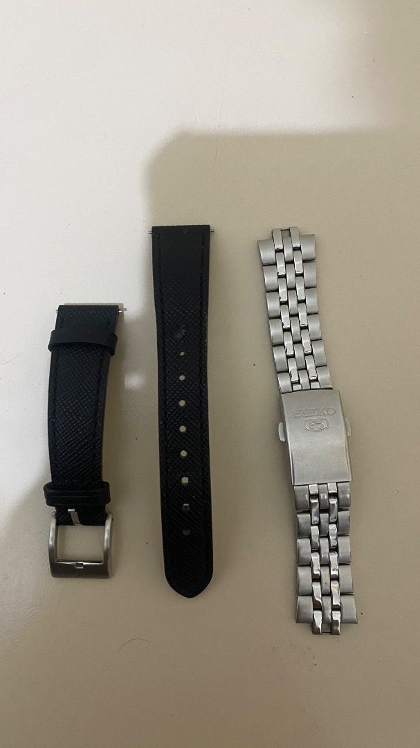 Seiko 5 Automatic Watch with Extra Straps (Category: Accessory Holder, Box & Organizers) located in Pasig City. Submitted by truewolf-30e0 (Listing ID 1462875421, Image 2). Description: - Seiko 5 Automatic Watch - Classic silver dial - Day and date function - Includes original seiko metal bracelet - Comes with two additional black leather straps - In good working condition - Ideal for everyday wear.