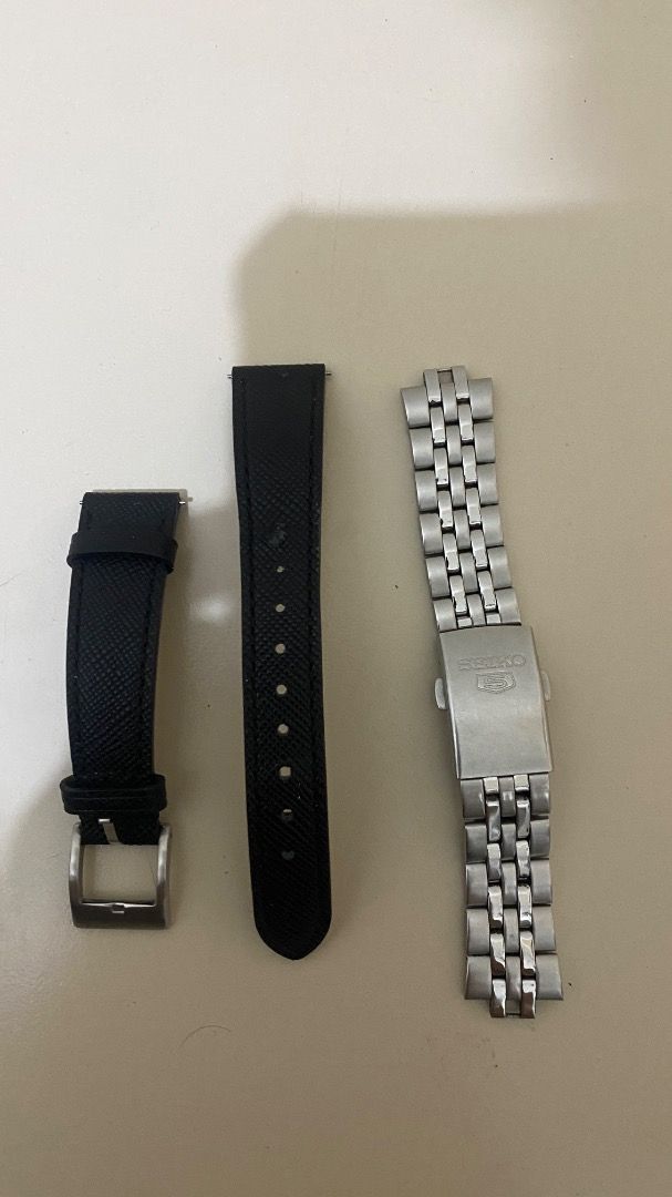Seiko 5 Automatic Watch with Extra Straps (Category: Accessory Holder, Box & Organizers) located in Pasig City. Submitted by truewolf-30e0 (Listing ID 1462875421, Image 3). Description: - Seiko 5 Automatic Watch - Classic silver dial - Day and date function - Includes original seiko metal bracelet - Comes with two additional black leather straps - In good working condition - Ideal for everyday wear.