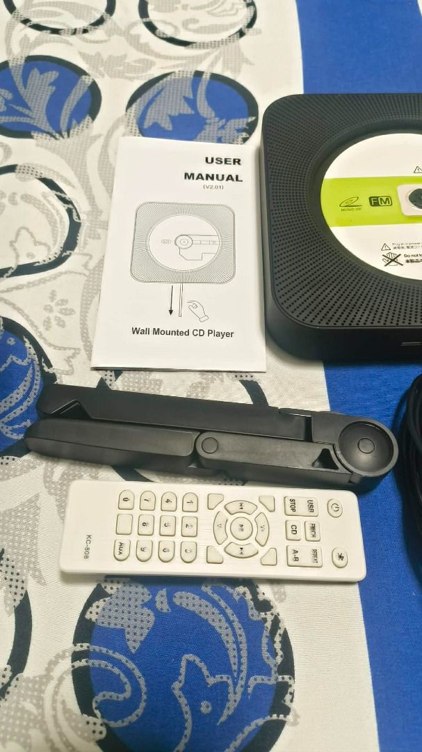Selling CD Player Wall Mounted w/ Built-in Speaker (Category: CDs & DVDs) located in Makati City. Submitted by gdzshop (Listing ID 1462814838, Image 2). Description: Selling CD Player Wall Mounted w/ Built-in Speaker Php 1,500 - bought for Php 1,800 - almost brand new condition - no issues - bought last July 2026 - inclusion: cd player, wall mount tray & kit, remote control, stand, and manual. RFS: upgrading Makati City location Lalamove for Deli