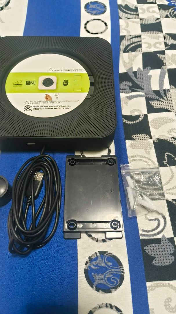 Selling CD Player Wall Mounted w/ Built-in Speaker (Category: CDs & DVDs) located in Makati City. Submitted by gdzshop (Listing ID 1462814838, Image 3). Description: Selling CD Player Wall Mounted w/ Built-in Speaker Php 1,500 - bought for Php 1,800 - almost brand new condition - no issues - bought last July 2026 - inclusion: cd player, wall mount tray & kit, remote control, stand, and manual. RFS: upgrading Makati City location Lalamove for Deli