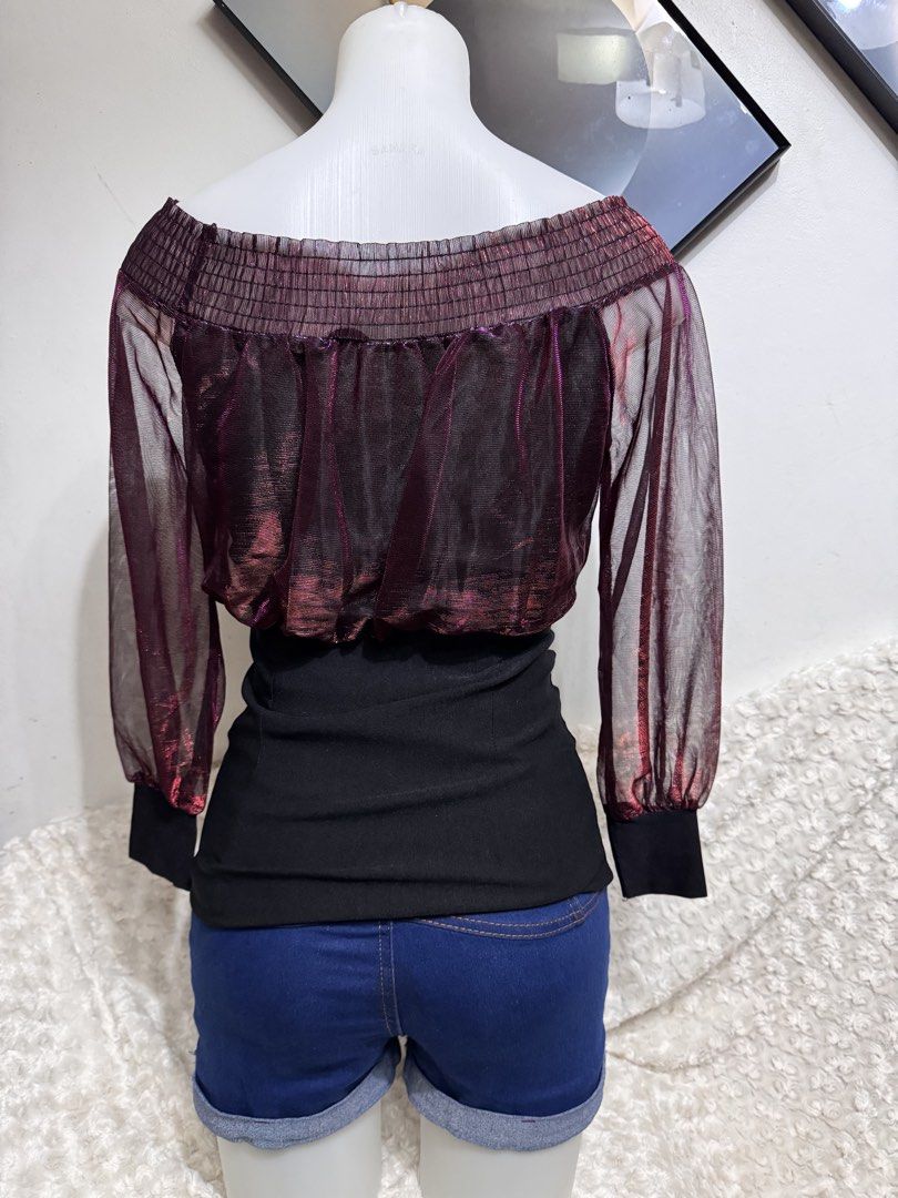 Sheer Off-Shoulder Top with Smocked Bodice (Category: Blouses) located in Marikina City. Submitted by lorradel (Listing ID 1462749971, Image 3). Description: - Burgundy sheer off-shoulder top - Smocked bodice with metallic threads - Long puff sleeves with elastic cuffs - Includes a black fitted underlayer - Ideal for parties or a night out - Versatile: pair with jeans or a skirt - MAY HAVE some washable stains (hindi maiiwasan) needs washing; had