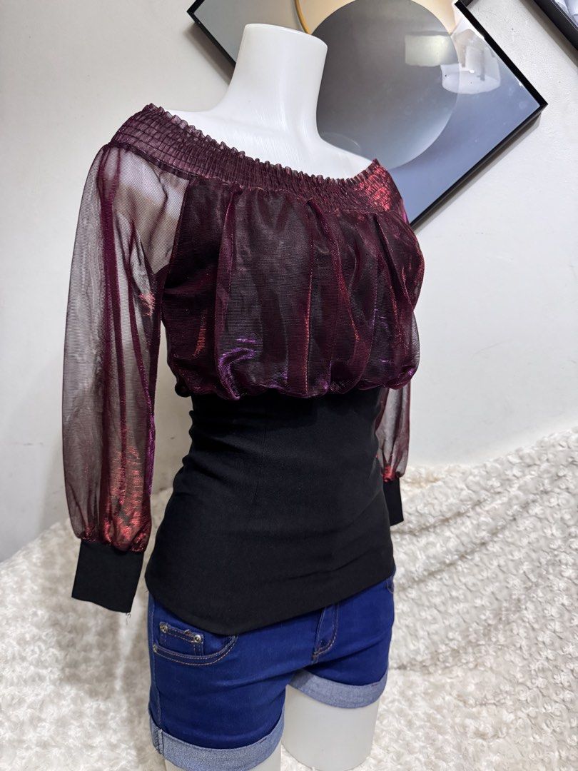 Sheer Off-Shoulder Top with Smocked Bodice (Category: Blouses) located in Marikina City. Submitted by lorradel (Listing ID 1462749971, Image 2). Description: - Burgundy sheer off-shoulder top - Smocked bodice with metallic threads - Long puff sleeves with elastic cuffs - Includes a black fitted underlayer - Ideal for parties or a night out - Versatile: pair with jeans or a skirt - MAY HAVE some washable stains (hindi maiiwasan) needs washing; had
