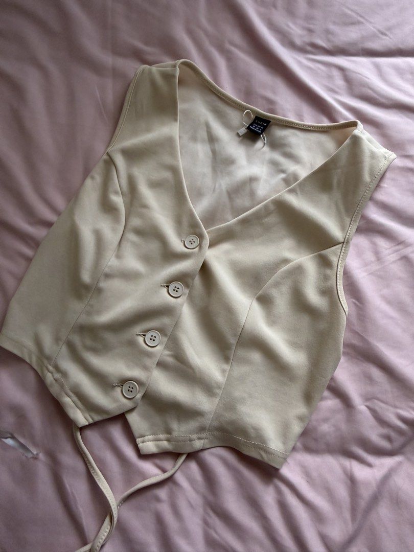 SHEIN Beige Vest and Pants Set (Category: Sets or Coordinates) located in Manila. Submitted by leean0924 (Listing ID 1462885042, Image 1). Description: - Beige vest and matching pants set from SHEIN - Size: Medium (M) for both pieces - Vest features button front and adjustable tie back - Pants are high-waisted with a flattering straight leg cut - Versatile: Wear together for a polished look or separately - Ideal for creating chic, put-together ou