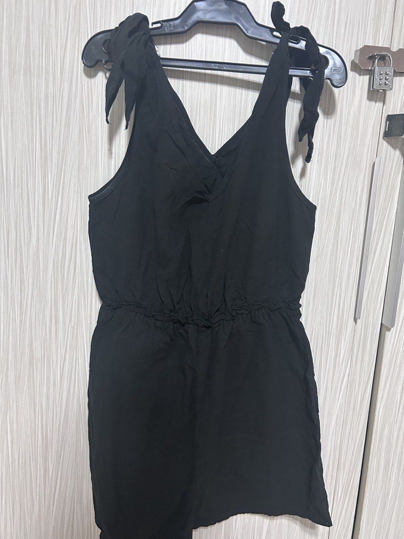 SHEIN Black Tie Shoulder Romper (Category: Rompers) located in Manila. Submitted by juvy13 (Listing ID 1462771183, Image 2). Description: - Black romper from SHEIN - Tie shoulder straps - Cinched waist with drawstring - V-neckline - Lightweight material - Easy to wear for casual outings - Check photos for details.