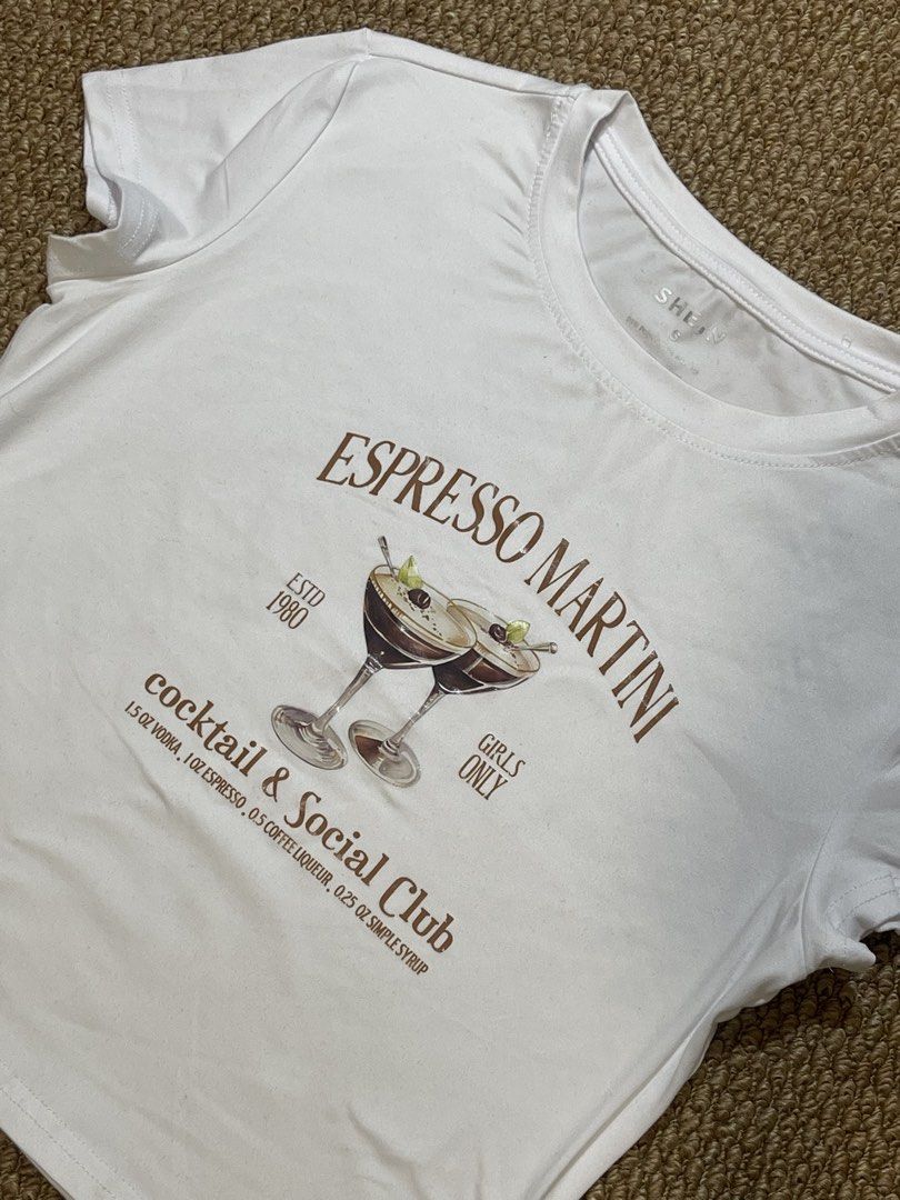 Espresso Martini Tee - S (Category: Shirts) located in Pasig City. Submitted by miafml-closet-cleanout (Listing ID 1462746779, Image 3). Description: - material: 95% polyester, 5% spandex posted price is fixed ♡ will not respond to hagglers. 💵 mop: gcash / bdo / maribank / unionbank 🛵 courier: any as long as arranged by buyer 🙅🏻‍♀️ no requested worn photos ❌ no meet-ups.