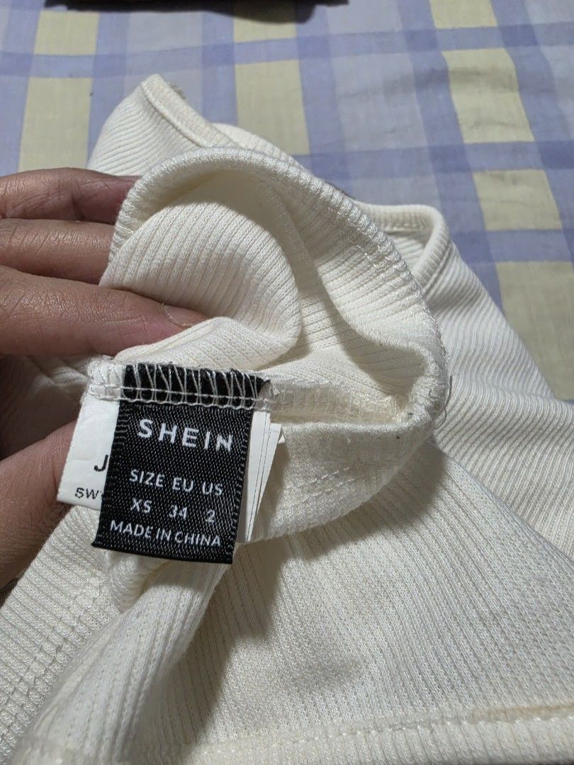 SHEIN Ribbed Knit Spaghetti Strap Crop Top XS (Category: Sleeveless) located in Paranaque City. Submitted by franinnashop (Listing ID 1462689905, Image 3). Description: - SHEIN white ribbed knit crop top - Spaghetti strap design - Perfect for layering or wearing solo - Super comfy and stretchy material declutter xs to small paranaque city.