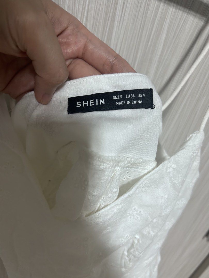 SHEIN White Layered Hem Cami top (Category: Others Tops) located in Manila. Submitted by juvy13 (Listing ID 1462769016, Image 3). Description: - Cute white crop top from SHEIN - Features eyelet embroidery - Ruffled hem detail - Adjustable spaghetti straps - Side zipper closure - Ideal for summer outfits - Size: Small (S).