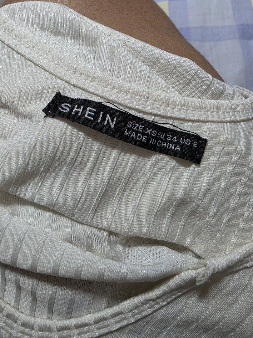 SHEIN White Ribbed Lettuce Hem Tank Top extra small (Category: Sleeveless) located in Paranaque City. Submitted by franinnashop (Listing ID 1462693966, Image 3). Description: - White ribbed tank top from SHEIN - Features a cute lettuce hem detail on neckline and bottom - Super stretchy material for a comfortable fit - Versatile piece, great for layering or wearing on its own declutter xs to small paranaque city.