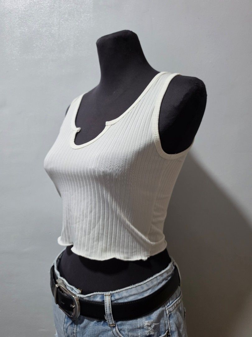 SHEIN White Ribbed Lettuce Hem Tank Top extra small (Category: Sleeveless) located in Paranaque City. Submitted by franinnashop (Listing ID 1462693966, Image 2). Description: - White ribbed tank top from SHEIN - Features a cute lettuce hem detail on neckline and bottom - Super stretchy material for a comfortable fit - Versatile piece, great for layering or wearing on its own declutter xs to small paranaque city.